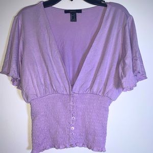 Low v neck lilac blouse with buttons half way up